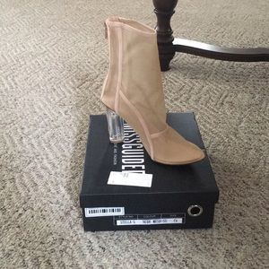 Nude Mesh shoe with suede detail and clear heel